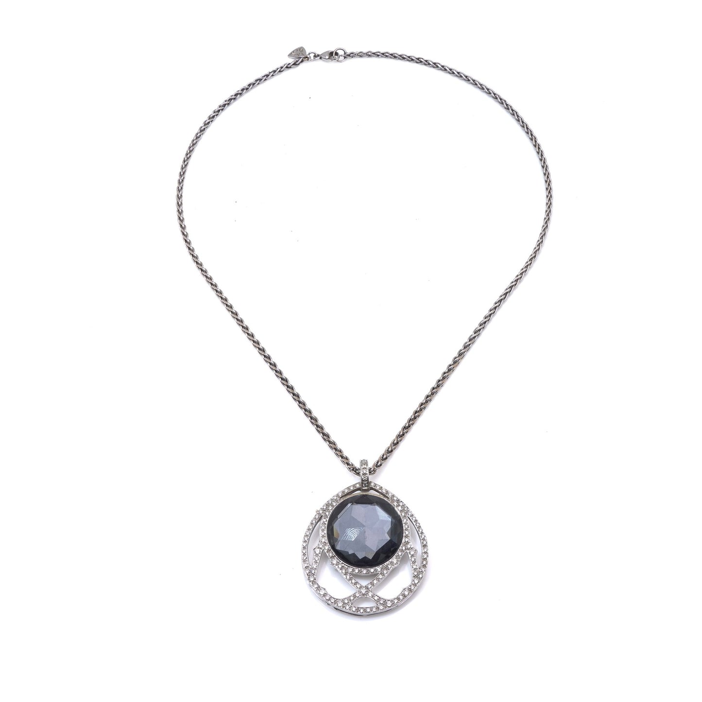A dark crystal and white diamond pendant with a white gold chain