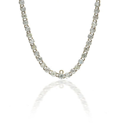 An antique diamond riviere necklace in yellow gold