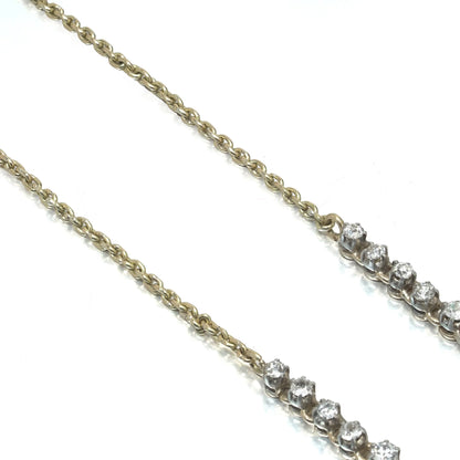 An antique diamond riviere necklace in yellow gold