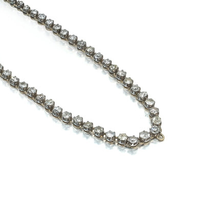An antique diamond riviere necklace in yellow gold