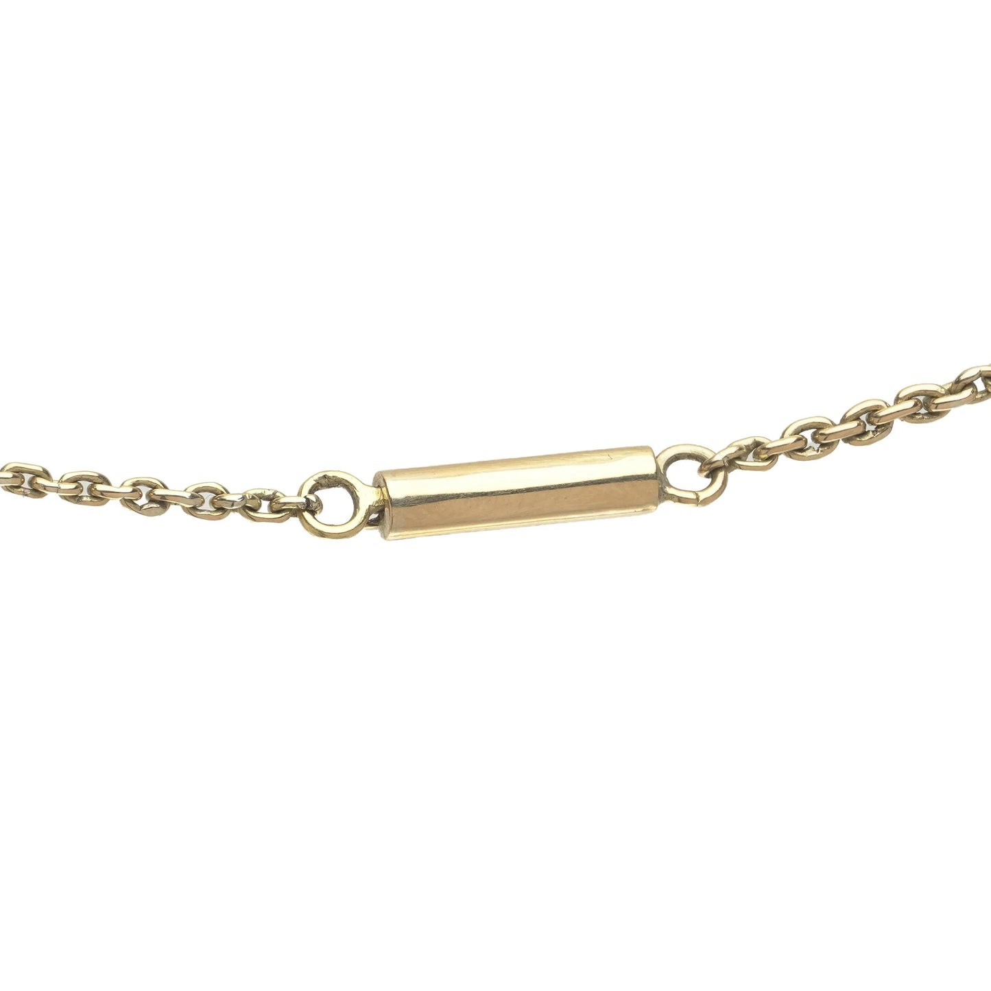 Close-up of a yellow gold barrel clasp