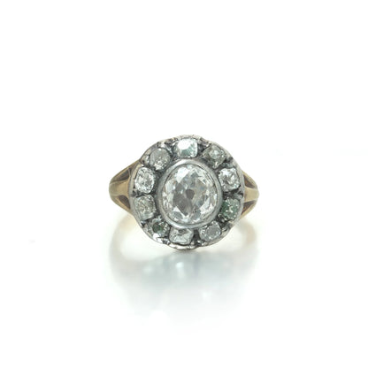 An antique diamond cluster ring in yellow gold and silver
