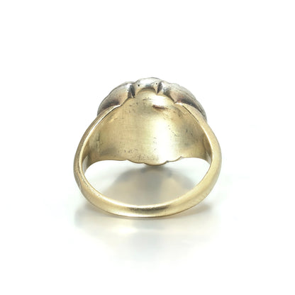 An antique diamond cluster ring in yellow gold and silver