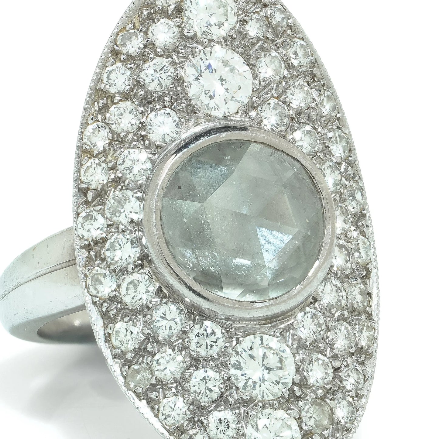 A marquise shaped diamond cluster ring with a central rose cut diamond, in white gold