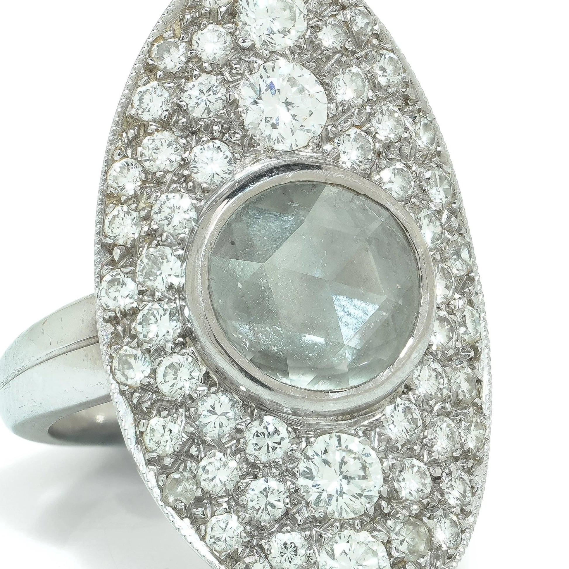 A marquise shaped diamond cluster ring with a central rose cut diamond, in white gold