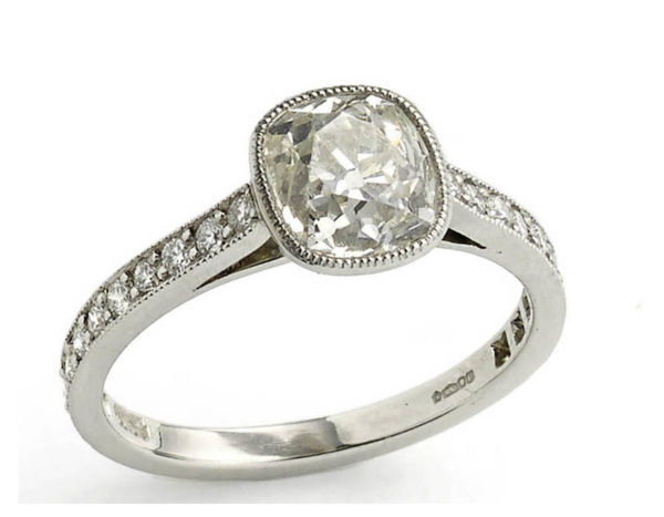 Cushion cut diamond engagement ring old cut platinum bezel rub over setting