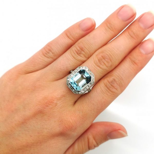 Antique Art Deco Aquamarine Diamond Ring, central 5.87ct emerald-cut aquamarine surrounded by 0.48cts eight-cut diamonds, in platinum