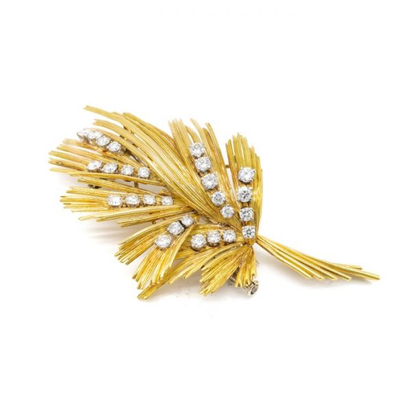 Vintage Gübelin Diamond Gold Brooch; set with approximately 1.84 carats of round brilliant-cut diamonds in an abstract bouquet spray design, Circa 1960