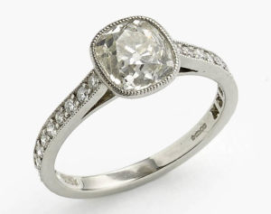 Cushion cut diamond engagement ring old cut platinum bezel rub over setting