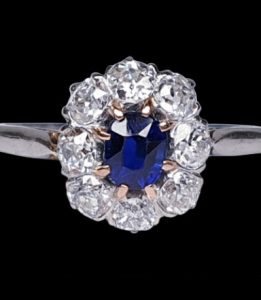 Art Deco Sapphire and Diamond Cluster Engagement Ring, royal blue oval cut sapphire weighing 0.60cts surrounded by charming old cut diamonds 0.80cts