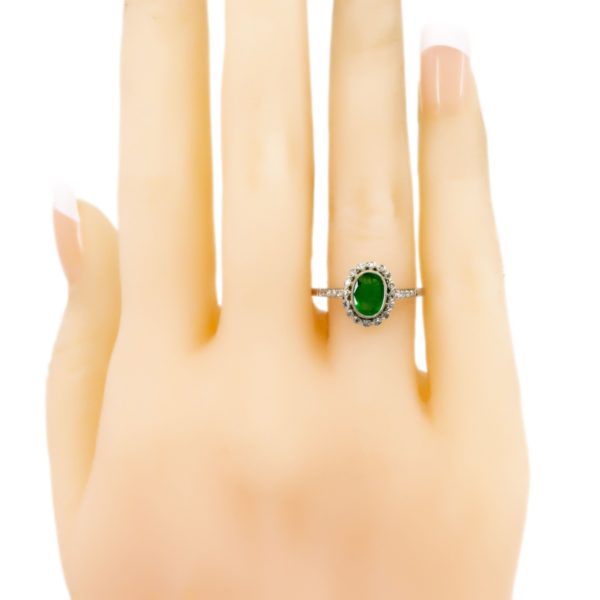 Diamond-and-Emerald-Platinum-Ring-on-hand