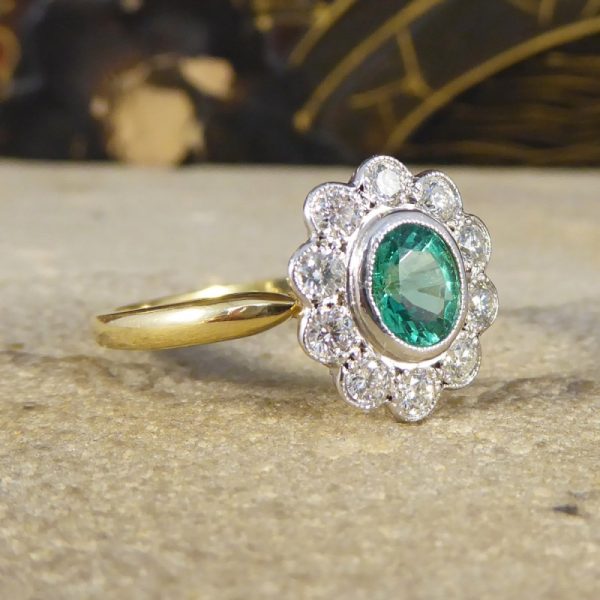 0.50ct Oval Cut Emerald and Diamond Cluster Ring