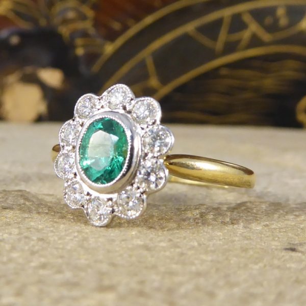 0.50ct Oval Cut Emerald and Diamond Cluster Ring