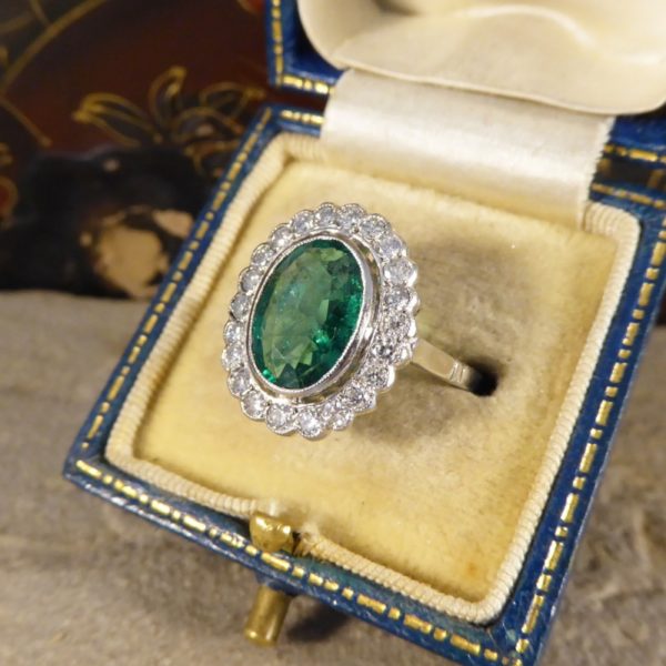 1.45ct Oval Cut Emerald and Diamond Cluster Ring