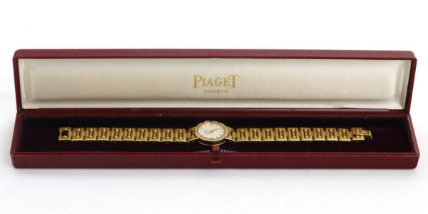 Piaget Diamond Dancer Watch in 18K Yellow Gold. Mother of pearl dial with diamond hour markers. and diamond set bezel. With Box. Quartz