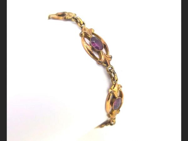Victorian Almondine Garnet Bracelet; Purple almondine garnets set in high relief and forged in 9ct yellow gold link bracelet