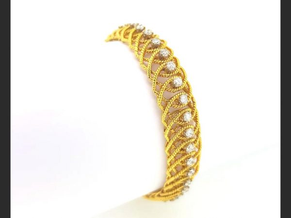Diamond and Golden Flexbile Rope Twist Bracelet; A flexible golden rope twist design bracelet with central diamonds totaling an estimated 2.50 carats