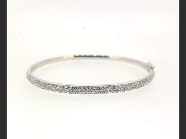 Diamond Bangle; Round cut diamonds pave set into an 18ct white gold bangle. Diamond total weight: 1.50 carats. Also available in 18ct yellow or rose gold