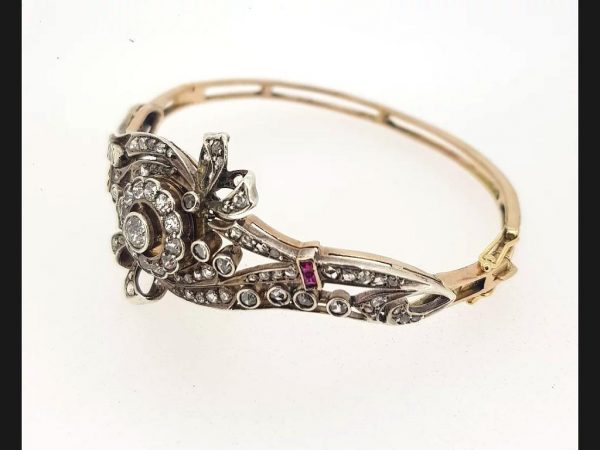 Vintage diamond and ruby bangle, intricate floral bow design, Circa 1930's