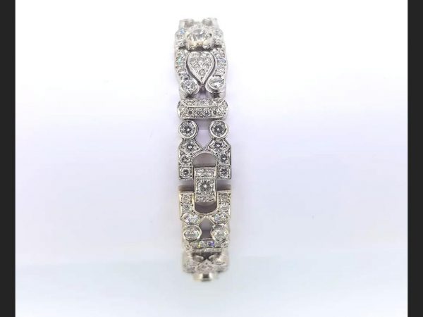 Vintage diamond set bracelet emulating a hint of the Art Deco style. Diamonds totaling an estimated 12 carats.