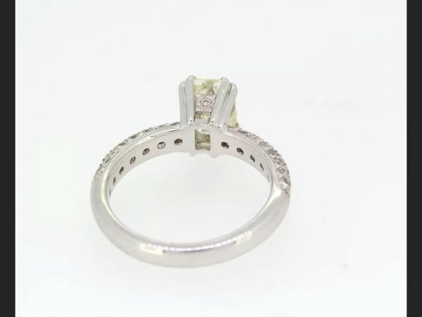 Emerald Cut Diamond Ring, with pave set shoulders, set in 18ct white gold