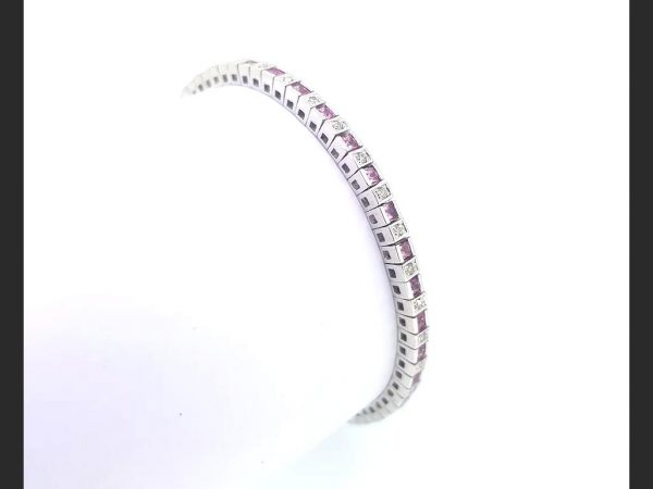 A classic pink Sapphire and Diamond Line Bracelet, gemstones totaling 2.00 carats (princess cut pink Sapphires 1.50ct, round cut diamond totals 0.50ct)