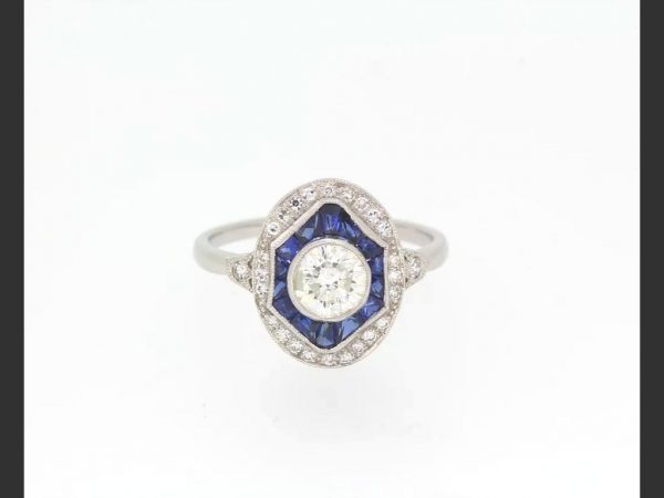 Art Deco Style Sapphire and Diamond ring target style Calibre Set Ring; Central 0.70ct diamond surrounded by sapphires and diamonds, with diamond set shoulders