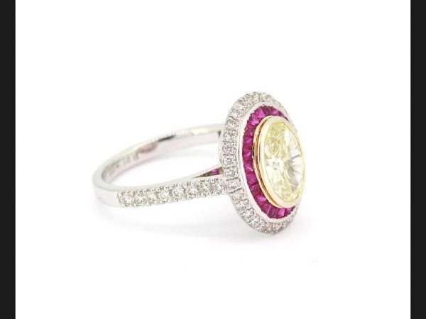 Oval cut Fancy Yellow Diamond and Ruby Calibre Set Ring, certified