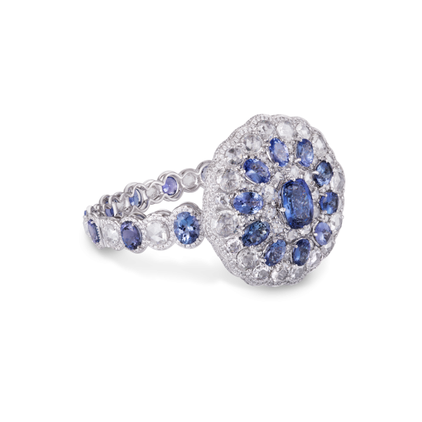 Tanzanite and Rose Cut Diamond Cuff Bracelet; central oval tanzanite, encased with rose-cut diamonds and pear-cut tanzanites, 43.27ct total, 18ct white gold
