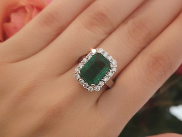 Emerald Cut Emerald and Diamond Cluster Ring in 18ct White Gold