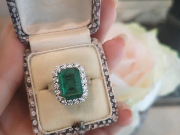 Emerald Cut Emerald and Diamond Cluster Ring in 18ct White Gold