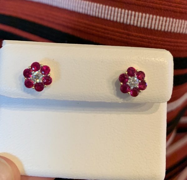 Ruby and diamond flower head cluster earrings yellow gold