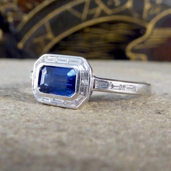 Emerald Cut Sapphire and Diamond Cluster Ring in Platinum