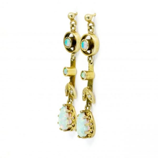 Vintage Opal, Old Cut Diamond and Gold Drop Earrings; featuring pear-shaped and round cabochon opals accented with old mine-cut diamonds. Circa 1910-1940.