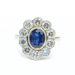 Vintage Oval Cut Sapphire and Diamond Cluster Ring