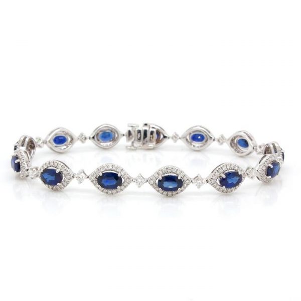 8.01ct Sapphire and Diamond Cluster Bracelet in 18ct White Gold; featuring thirteen oval sapphire and diamond clusters; sapphires 8.01cts, diamonds 1.85cts