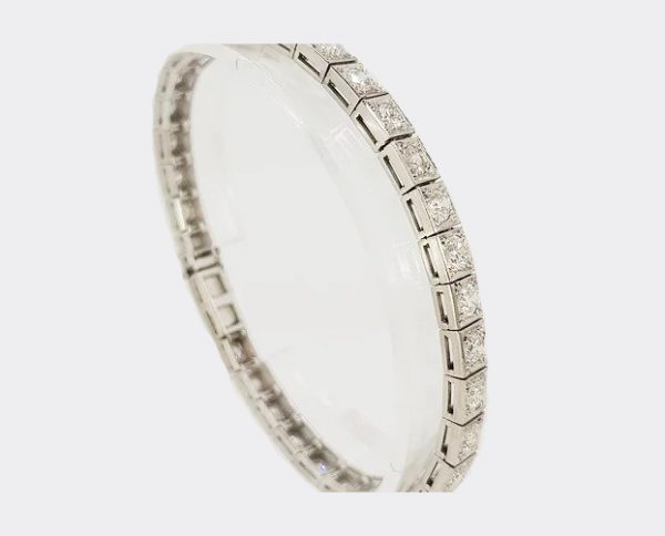 Art Deco Diamond and Platinum Line Bracelet; square collet-set diamond line bracelet crafted in platinum. Total diamond weight: 5.00 carats (estimated)