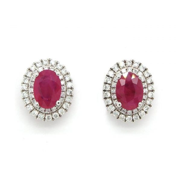 Pair of 2.13ct Ruby and 0.48ct Diamond Oval Cluster Earrings; central oval faceted ruby within a double surround of brilliant cut diamonds, 18ct white gold