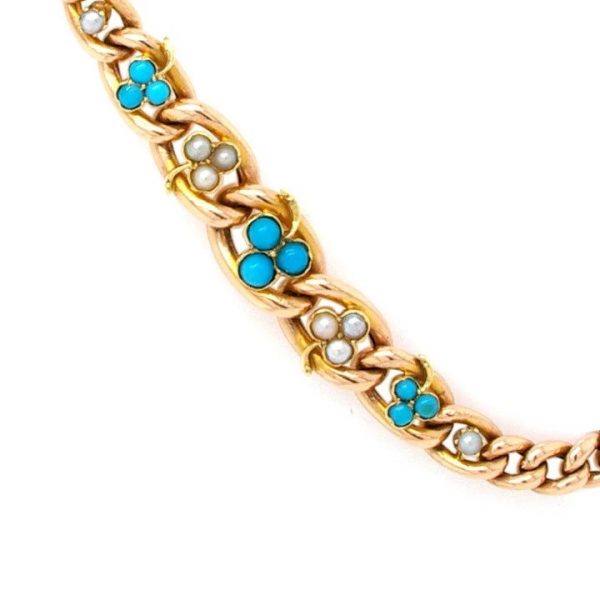 Antique 9ct Yellow Gold, Pearl and Turquoise Clover Leaf Bracelet; An early 20th century 9ct chain link bracelet set with trios of pearls and turquoise. 