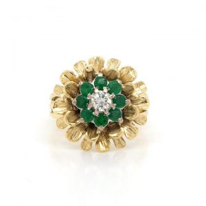 Vintage Emerald, Diamond and 18ct Gold Flower Cluster Ring; cluster of emeralds and diamond surrounded by textured gold petals, Circa 1960's