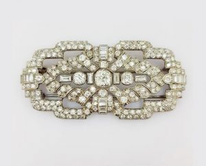 Antique Diamond and Platinum Brooch; A beautiful brooch crafted from platinum, the open-work design set with baguette-cut and circular-cut diamonds.