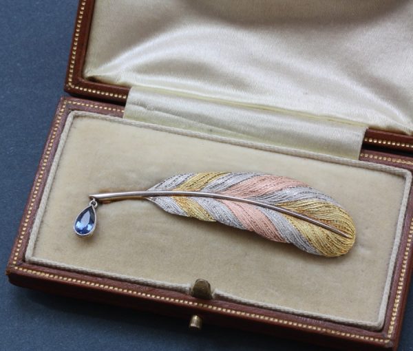 Antique Sapphire, Platinum and Gold Feather Quill Pen Brooch; A brooch representing a quill pen, 0.45ct sapphire drop; platinum and pink and yellow gold feather, with original case, Circa 1900