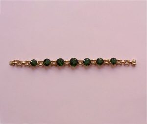 Vintage 24ct Green Tourmaline and Rose Gold Bracelet; link bracelet set with large brilliant cut tourmalines, claw-set in an open setting, USA, Circa 1950