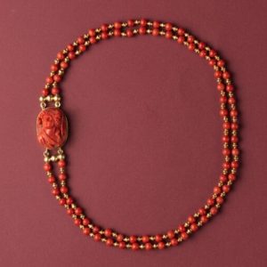 Vintage Jacob de Groes Coral Bead and Cameo Necklace; 18ct yellow gold double string of alternated bright red coral and gold beads, cameo set lock, c.1980.