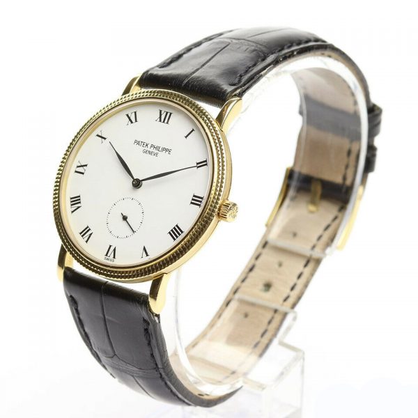 Patek Philippe Calatrava 18ct Yellow Gold 33mm Watch, 3919, porcelain white dial, Roman numerals, seconds sub-dial at 6, manual movement. With Patek Philippe strap, pouch and extract.
