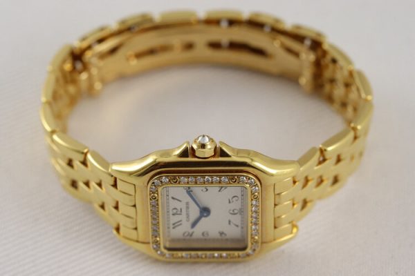 Cartier Panthere Ladies Original Diamonds 18ct Yellow Gold 22mm Quartz Watch, silver colour dial, Arabic numerals, sapphire glass, Cartier factory set diamond bezel and diamond crown, 18ct Yellow Gold bracelet with 18ct double-fold hidden clasp, with Cartier box.