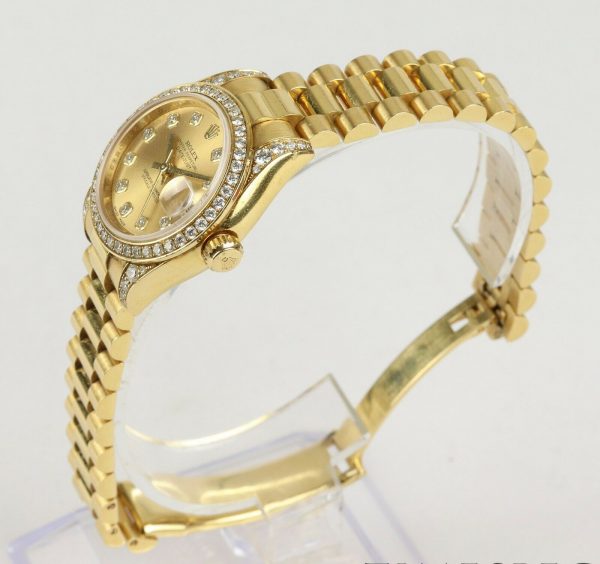 Rolex Oyster Perpetual 26mm Datejust 18ct Yellow Gold and Diamond Ladies Automatic Wrist Watch, Model 179158, 18ct Rolex President bracelet with single deployment clasp. With Rolex box and papers, Circa 2006/2007