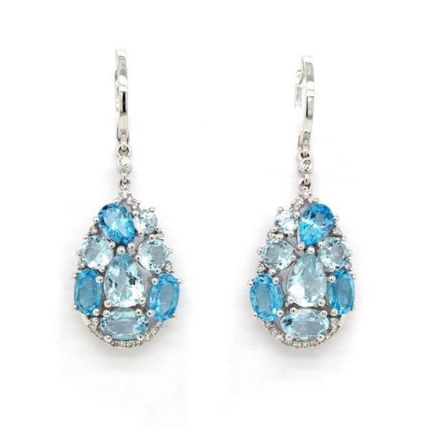 Pair of Blue Topaz and Diamond Abstract Drop Earrings; varied faceted topaz stones set into an oval shape, diamond-set base, 18ct white gold