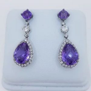 Amethyst and Diamond Pear Shaped Cluster Drop Earrings; pear-shaped rose-cut amethyst and diamond cluster suspended by an amethyst stud, via a brilliant cut diamond. Mounted in 18ct white gold.