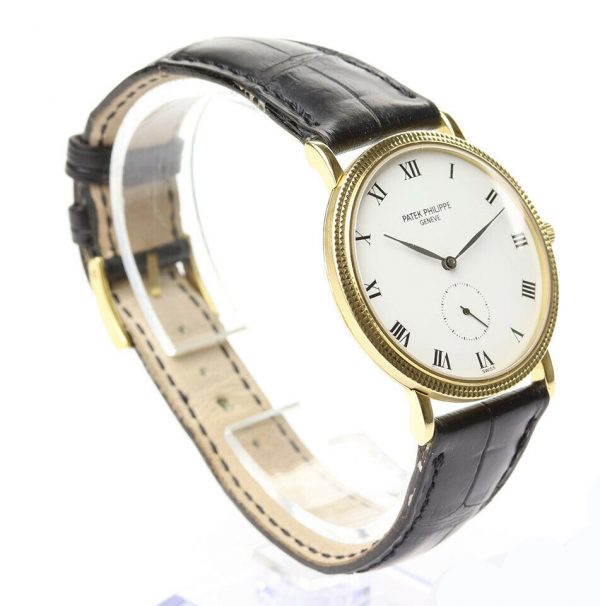 Patek Philippe Calatrava 18ct Yellow Gold 33mm Watch, 3919, porcelain white dial, Roman numerals, seconds sub-dial at 6, manual movement. With Patek Philippe strap, pouch and extract.